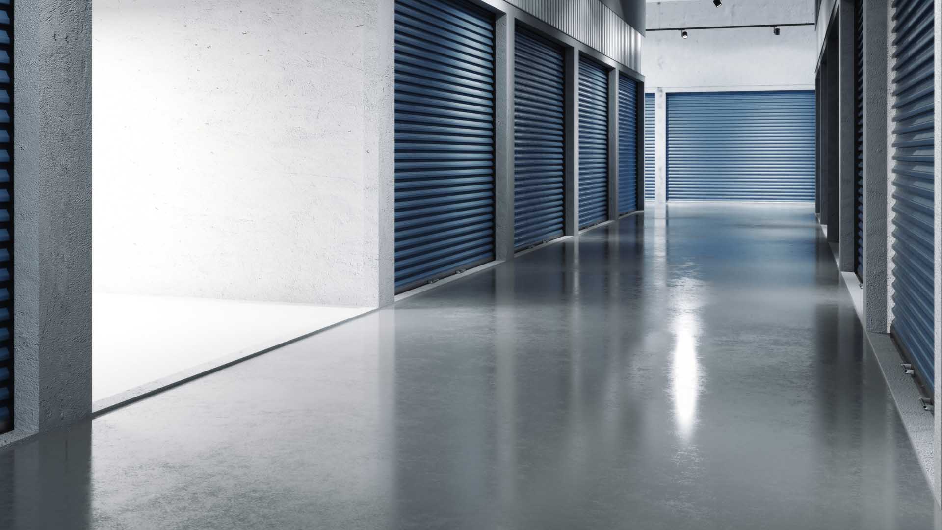 Storage facilities polished flooring with blue doors. Opened door. .. 3d rendering