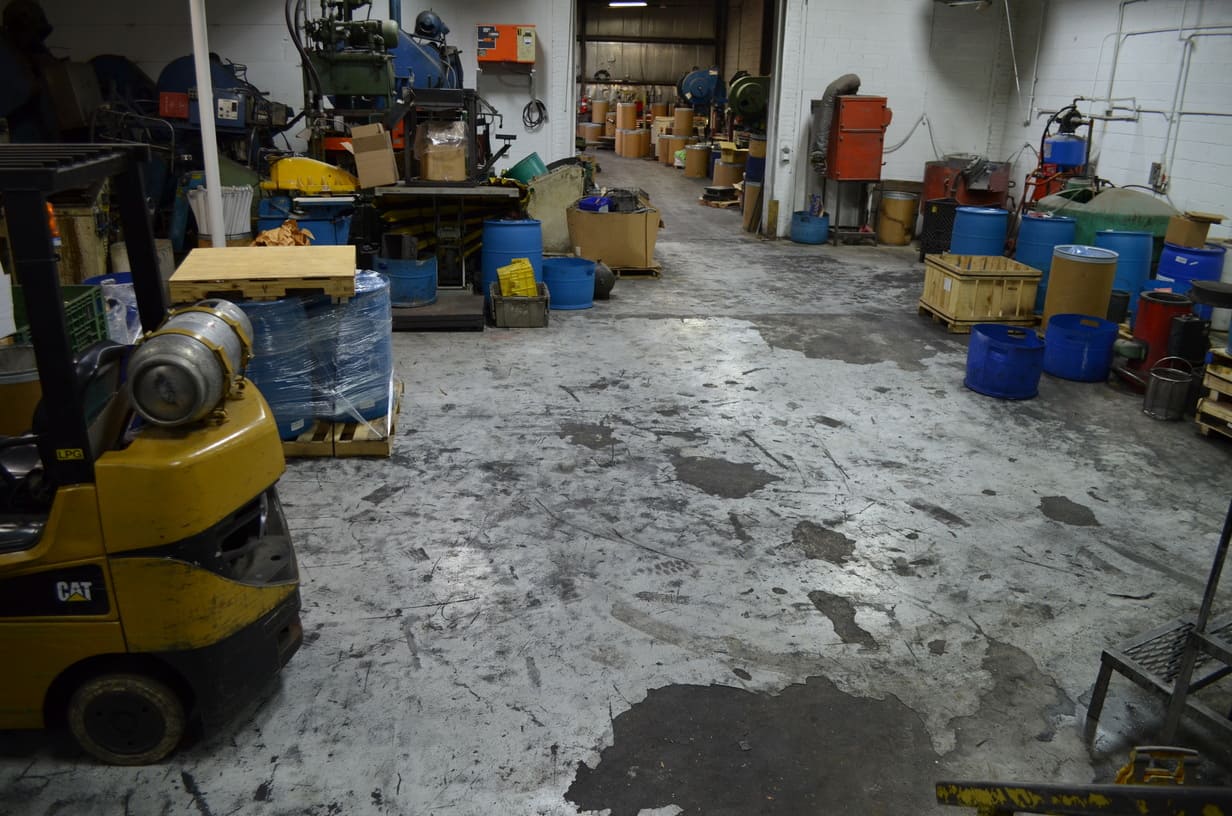 Manufacturing Plant storage area in need of flooring restoration