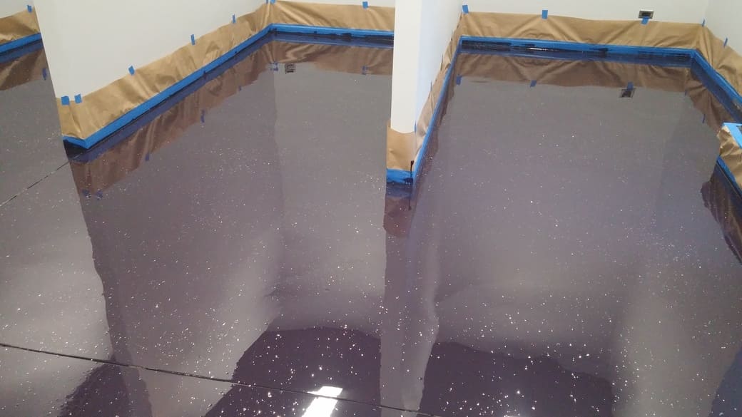 The entire 2,790 sq ft floor of this features a custom purple epoxy finish.